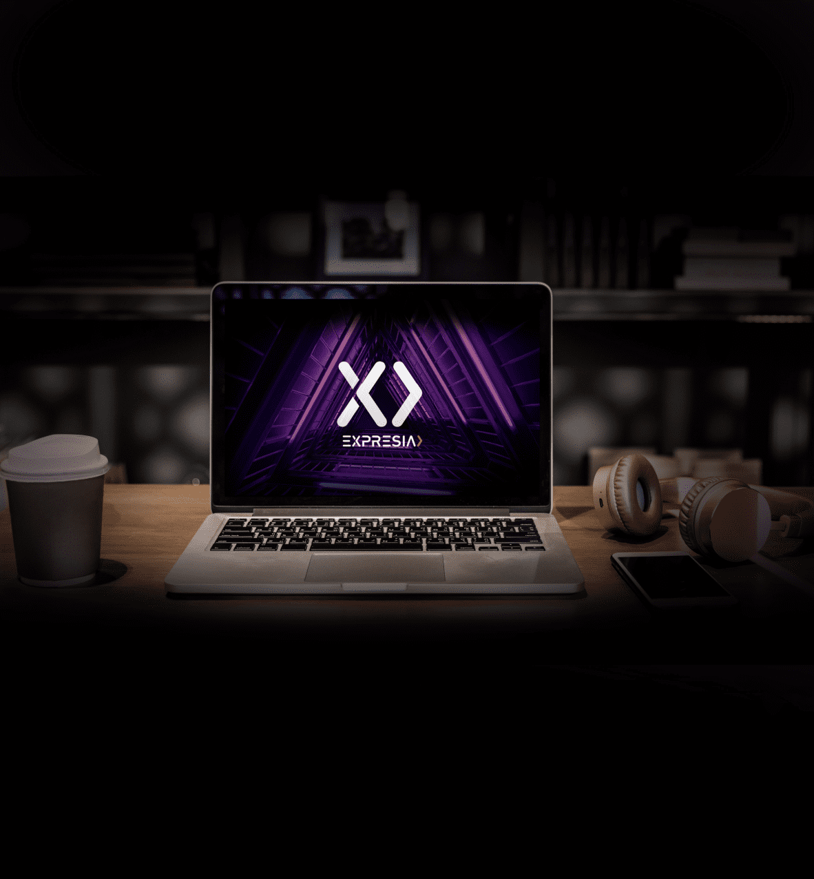 Become a partner Picture of a laptop under a spotlight with an Expresia's background